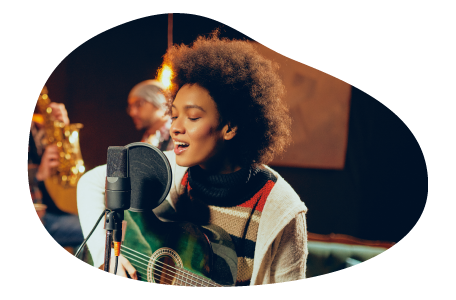 Member of American Federation of Musicians playing a guitar in a studio.